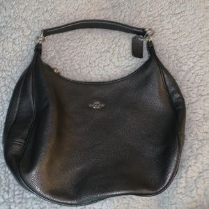 Harley leather hobo coach bag. Black bag with a gold tone.